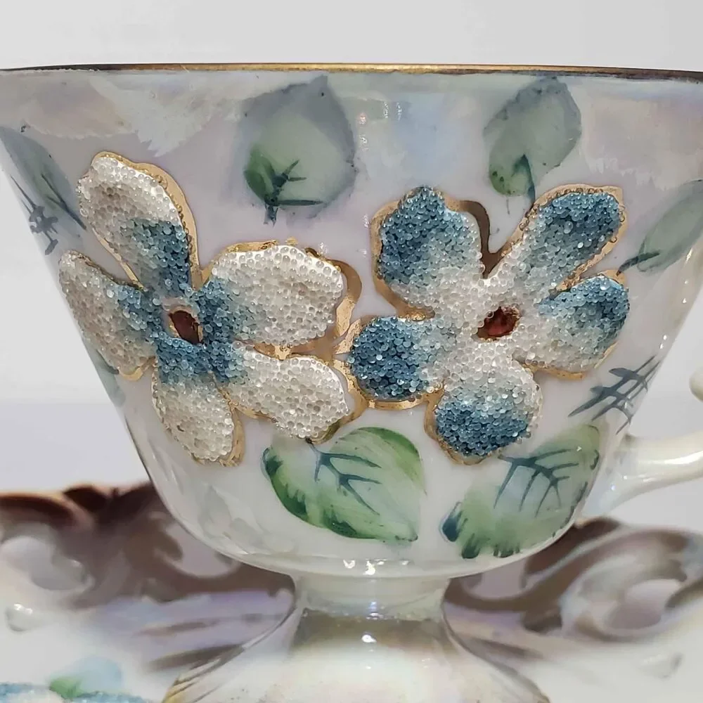 EFCCO Teacup and Saucer Blue White Textured Flowers Reticulated Opalescent